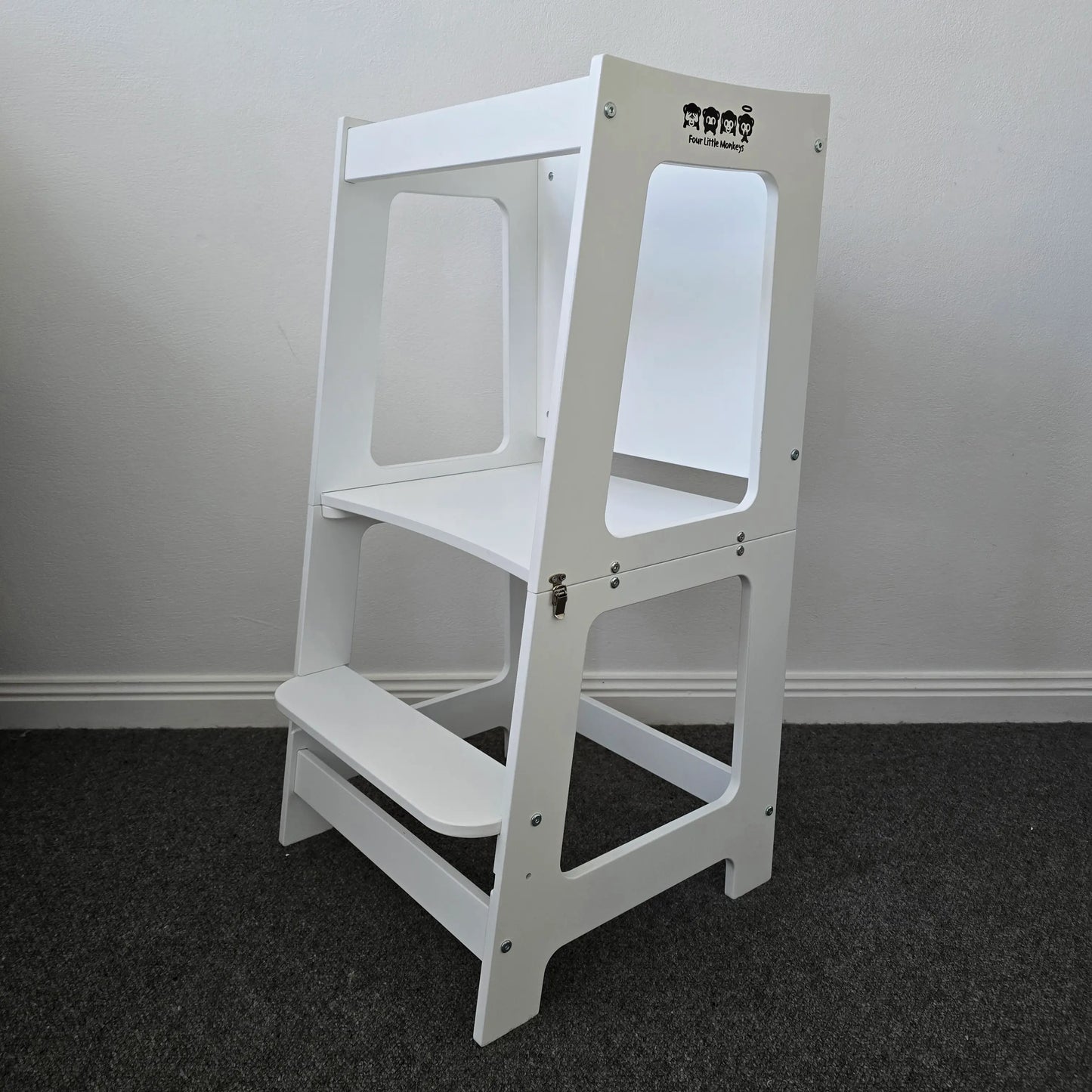 Front angle view of the Four Little Monkeys Convertible Learning Tower in its tower configuration, highlighting its sturdy structure.