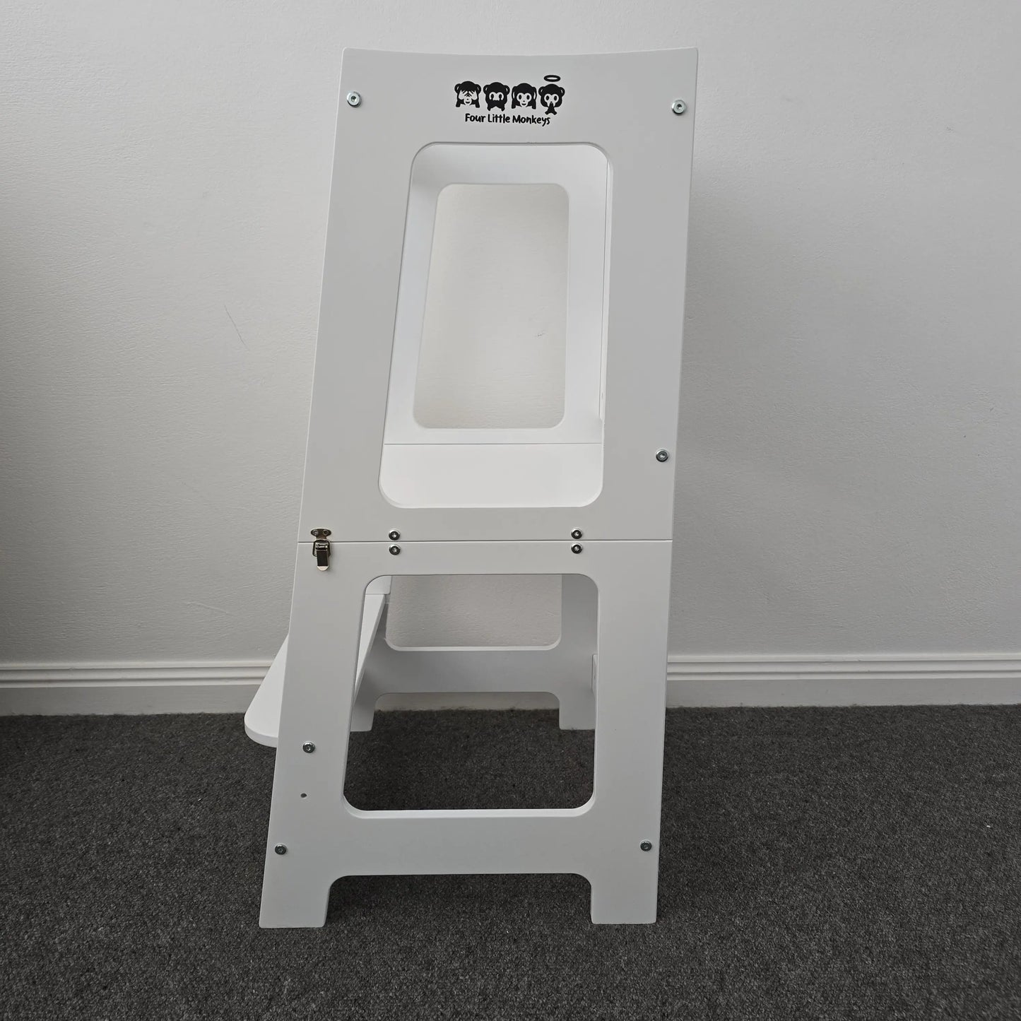 Side profile view of the Four Little Monkeys Convertible Learning Tower in its table configuration.