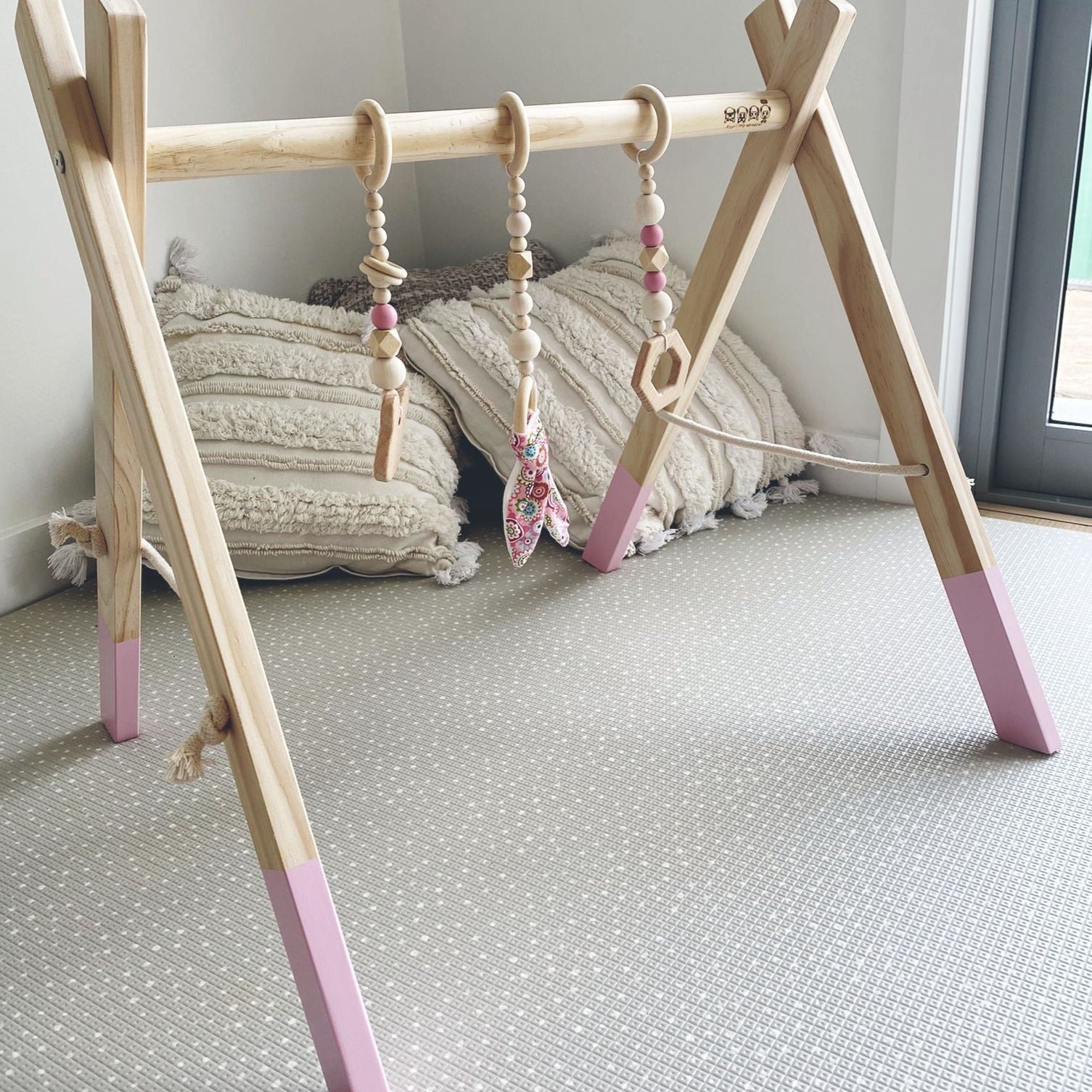 'Baby Play Gym in Pink colour' by Four Little Monkeys, exhibiting an eye-catching design with a pink touch and 3 removable hanging toys