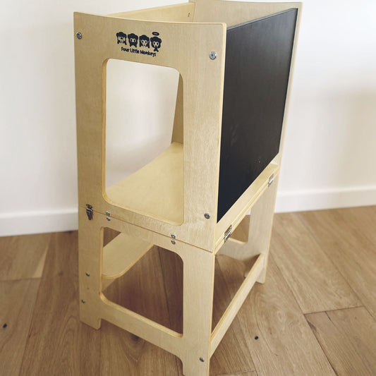 'Convertible Learning Tower with Blackboard in Natural finish' by Four Little Monkeys, efficiently switched from a study tower into a table setup with an attached blackboard.