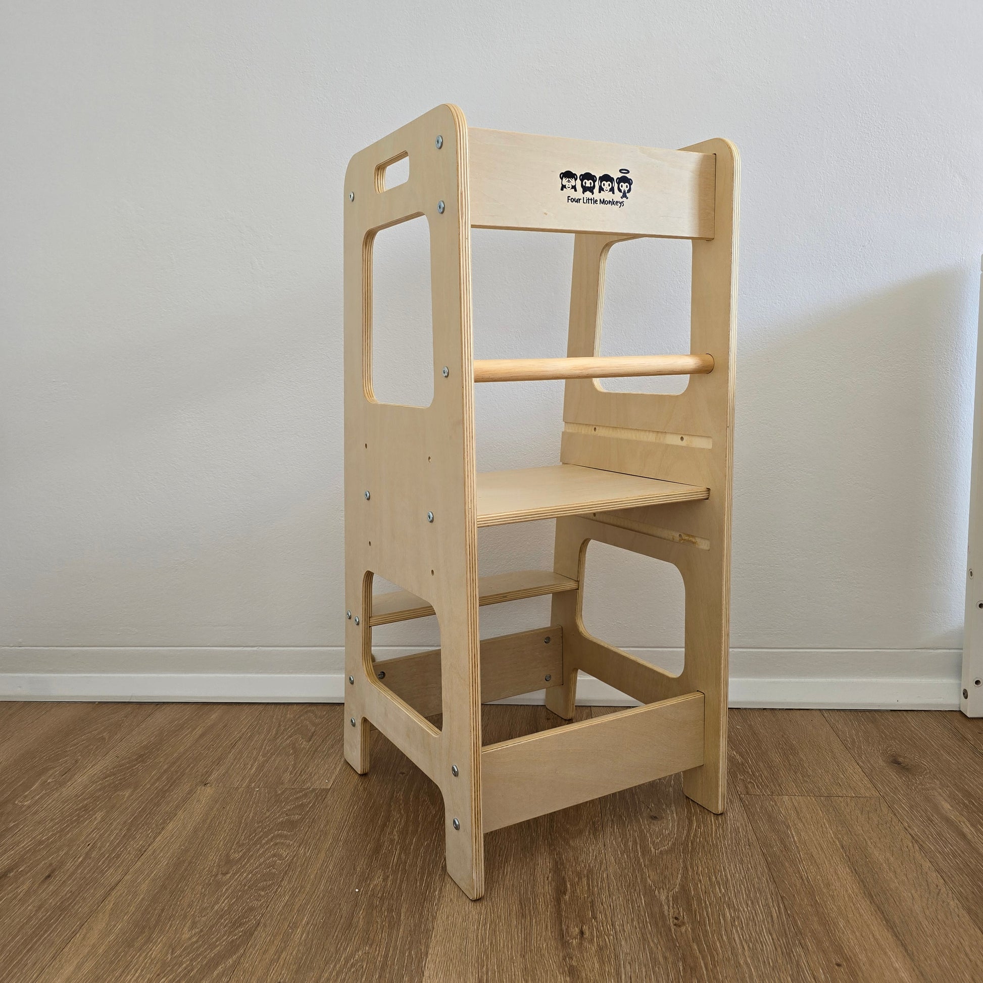 Back-angled view of the Natural Adjustable Learning Tower displaying the Four Little Monkeys logo.