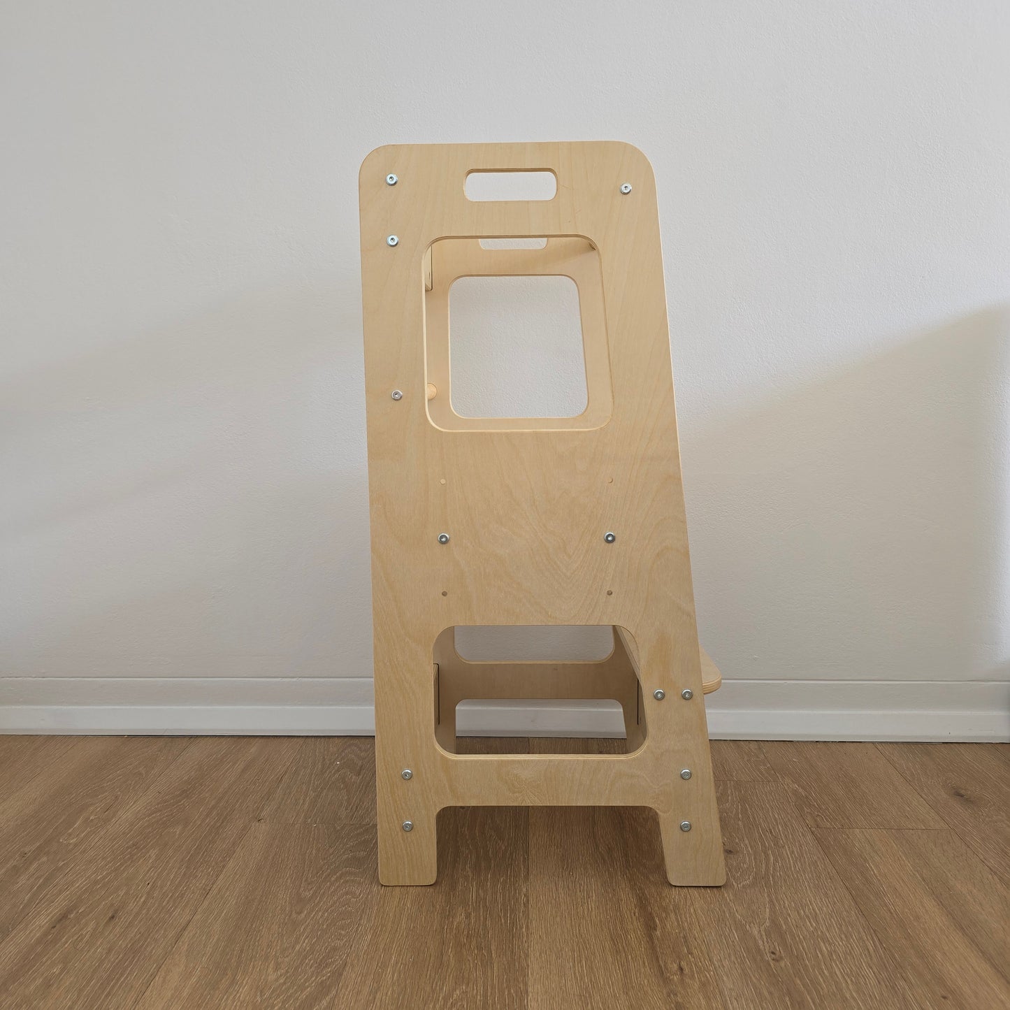 Side view of the Natural Adjustable Learning Tower, highlighting its sleek and sturdy construction.