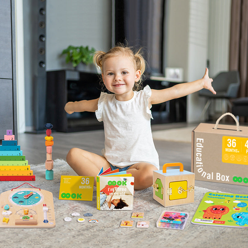 A delighted child aged 36+ months actively engaged in play with the various creative and educational toys from the Monkey Play and Learn Kit, designed to stimulate cognitive development and motor skills.