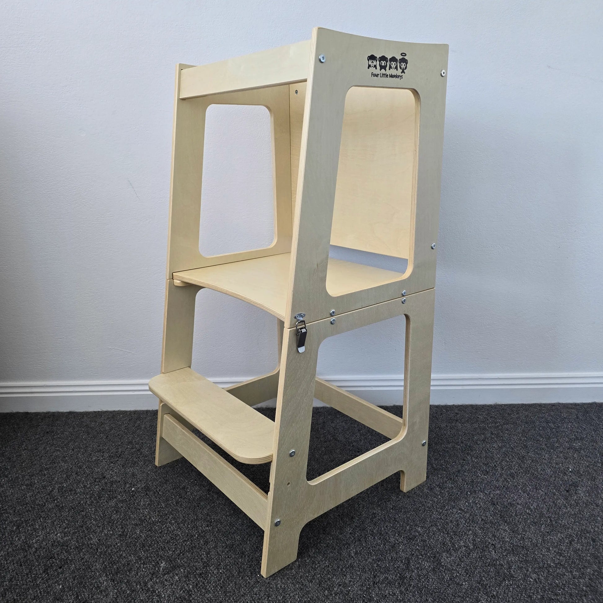 Front angle view of the wooden convertible learning tower in its tower configuration, showcasing its sturdy build and natural finish.