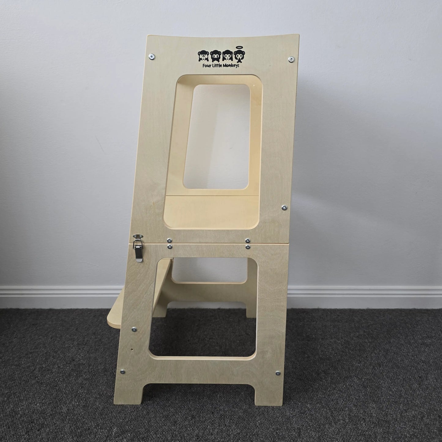 Side profile of the wooden convertible learning tower in its standing tower configuration, highlighting its natural wood finish.