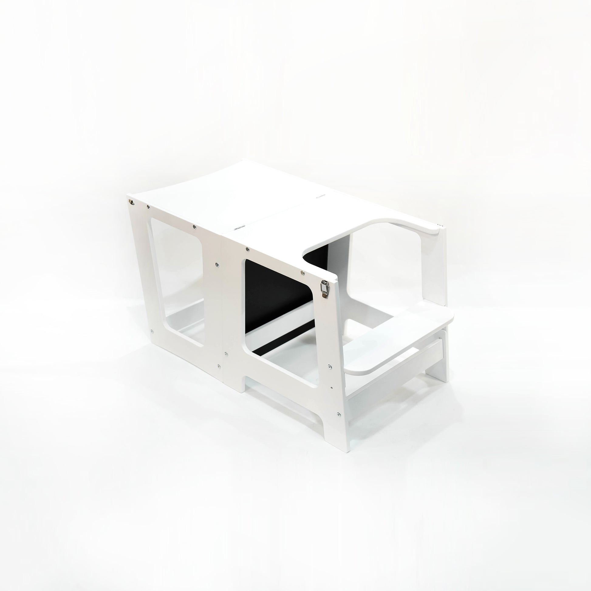 Angled view of the White Convertible Learning Tower in its table position, ready for children's activities