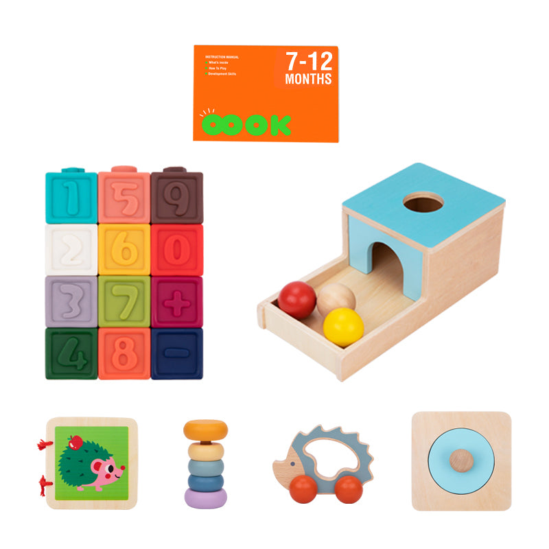 Contents of the Monkey Play & Learn Kit  for infants aged 7-12 months. It includes various Montessori-style toys like a Drop Ball Monkey Box, a puzzle, a wooden book, a Hedgehog Roller Rattle, a Tactile Baby Rattle, and soft building Monkey Blocks.