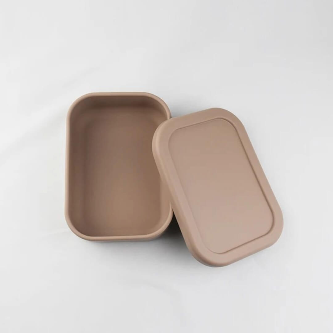 Warm taupe Silicone Bento Lunch Box featuring a child-friendly single compartment, crafted from sturdy, food-safe silicone with a secure, leak-proof lid for hassle-free mealtime.